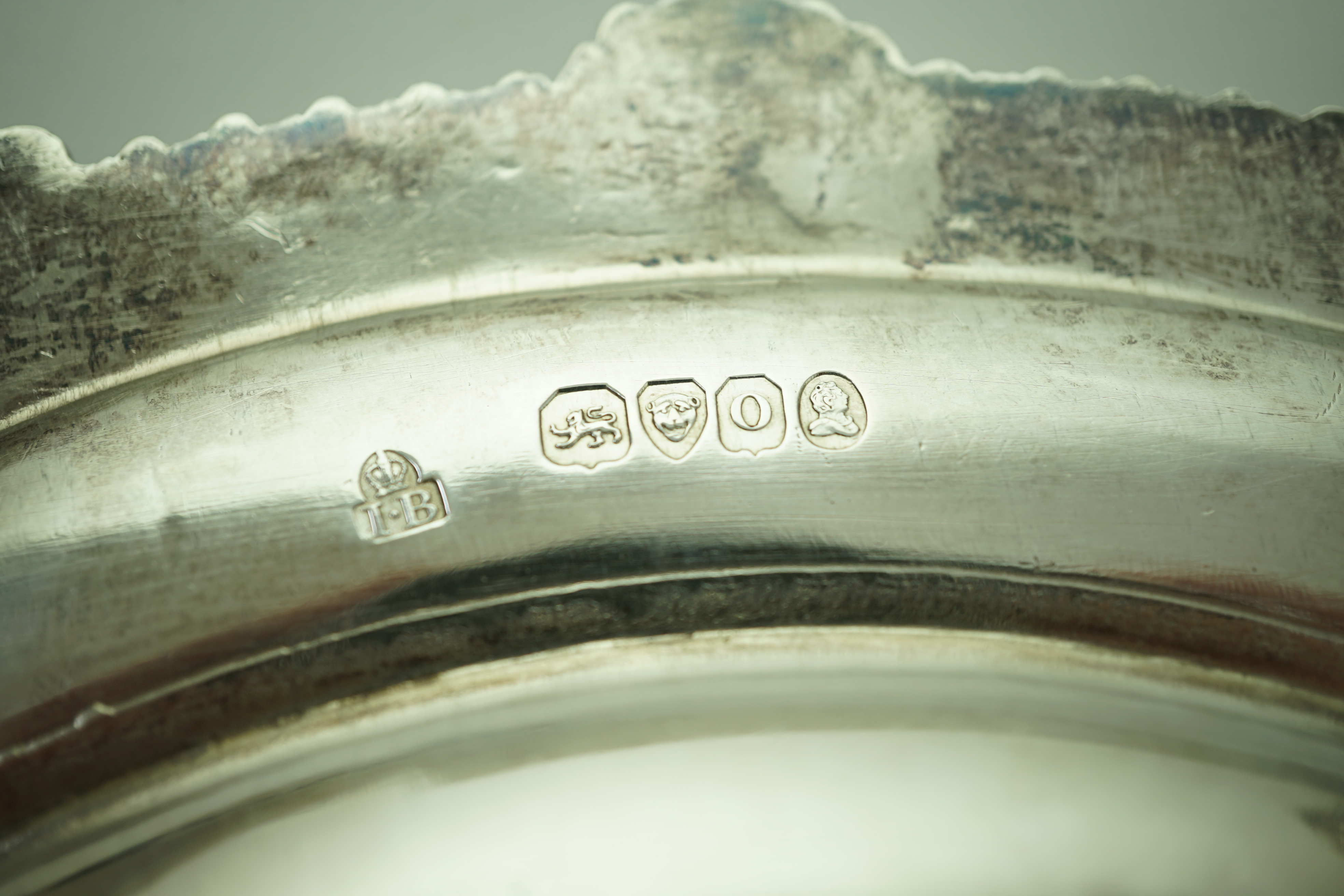 A set of four George IV silver dinner plates by Rundell, Bridge & Rundell